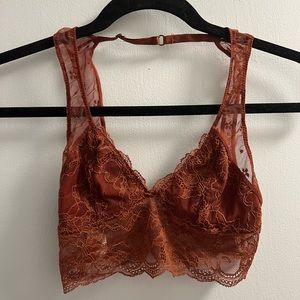 Burnt orange laced bralette top with open back and floral decal